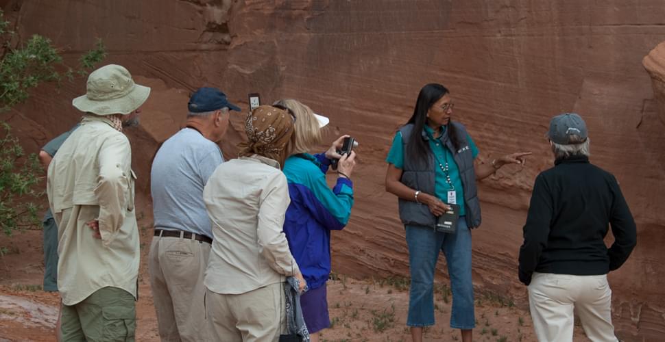 native american navajo guide with travelers